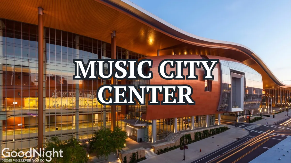 A daytime exterior shot of the Music City Center, surrounded by greenery and wide streets, with the city skyline in the background. The area is lively, hinting at a variety of cultural events and community gatherings within easy walking distance.