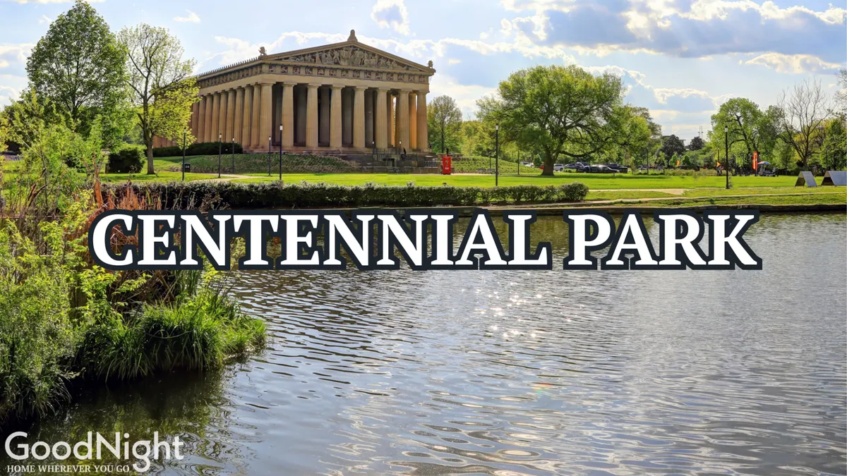 A serene scene at Centennial Park with the Parthenon-like structure in the background, calm water in the foreground, and lush greenery all around. The image captures people strolling and relaxing, highlighting the park's recreational atmosphere and natural beauty.